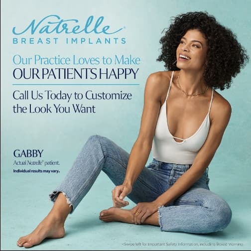 Woman sitting on the ground smiling