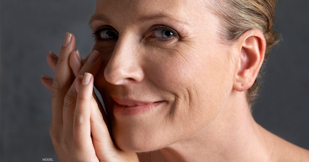 Woman with rejuvenated hands and ears