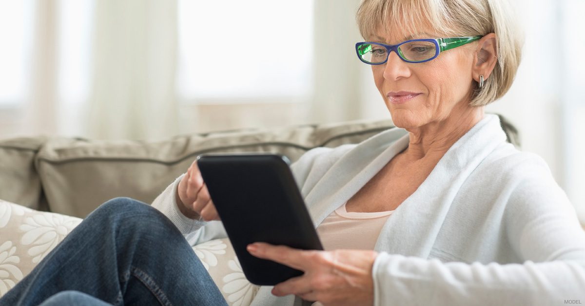 Woman looking at before-and-after photos