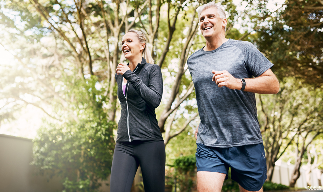 Confident, thin woman exercising with her husband after liposuction