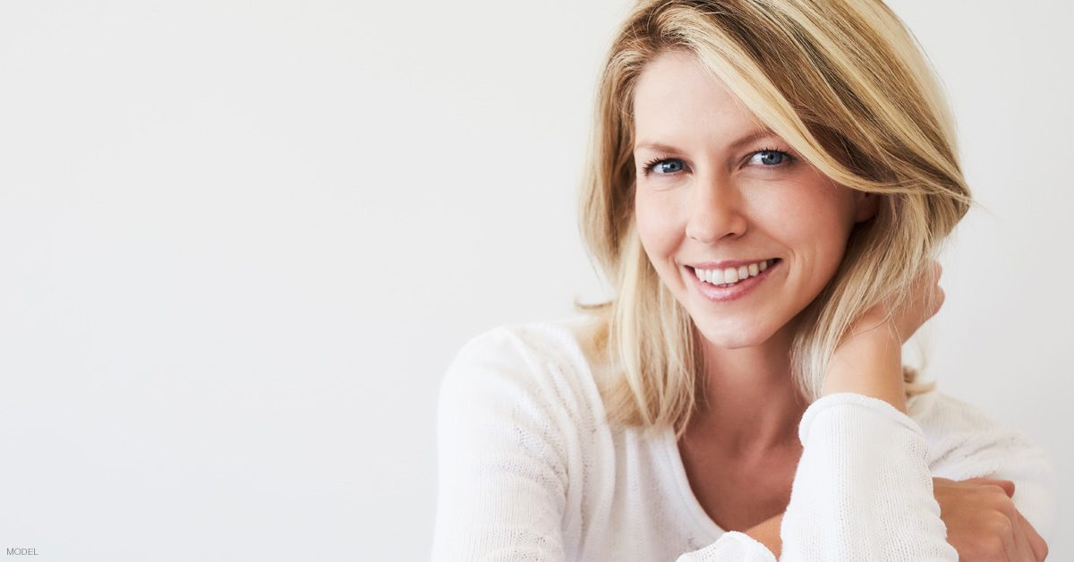 Woman smiling after consultation for facelift procedure in Los Angeles, California