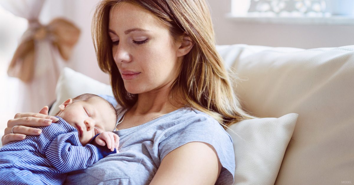 Woman in Los Angeles, CA with breast implants who breastfeeds her newborn