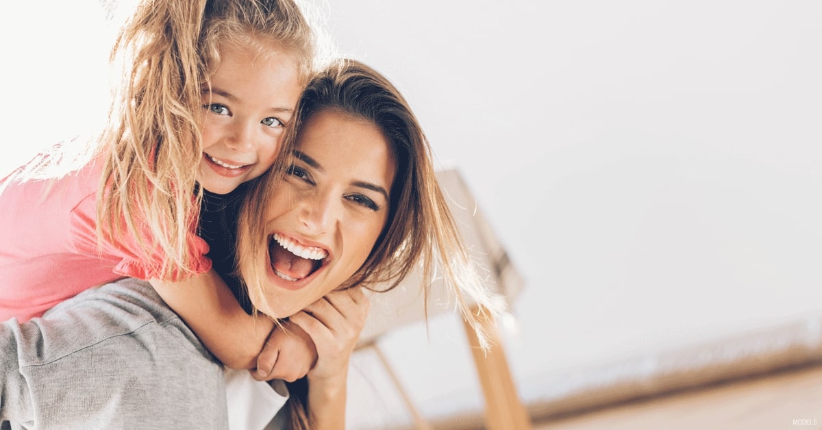 Mother and daughter playing with one another (MODELS)