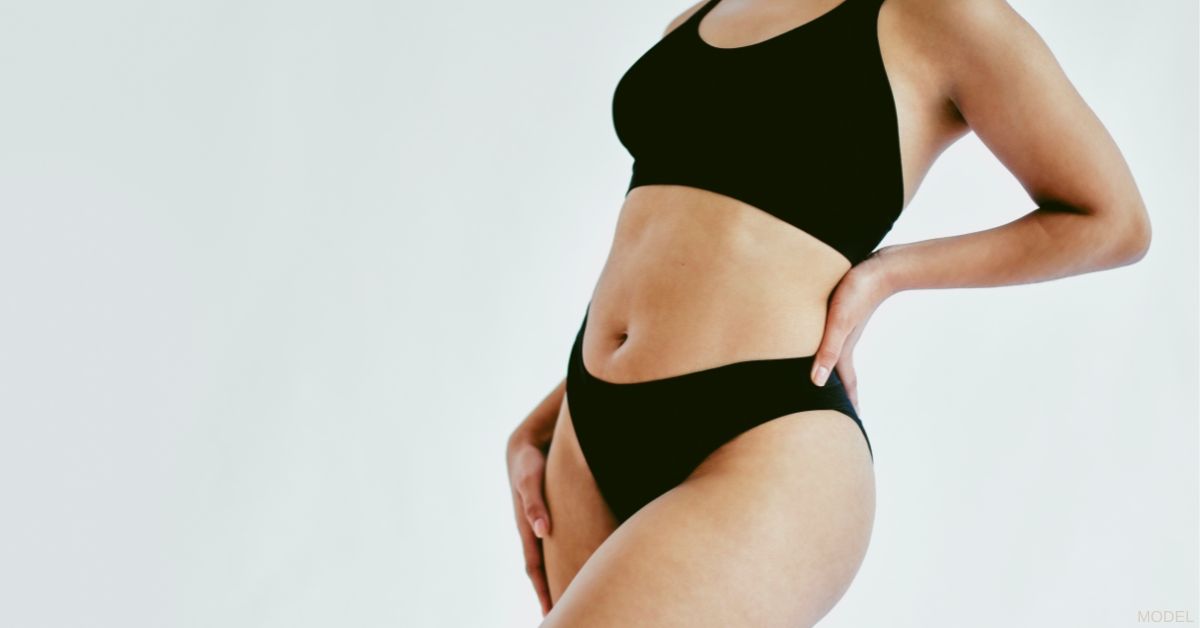 Woman's torso wearing black bra and underwear (model)