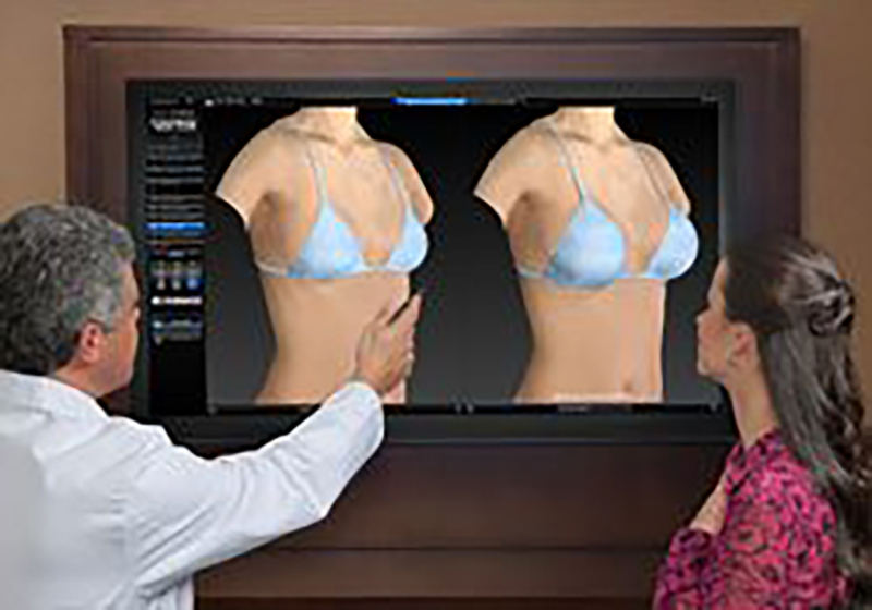 Doctor showing patient implants with vectra