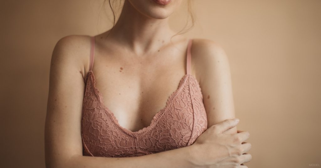 Woman in a pink bra top posing for the camera (model)